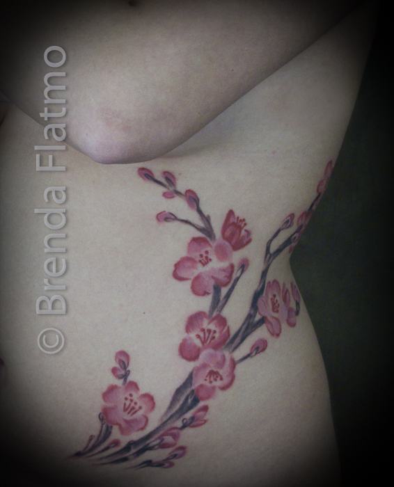 cherry blossom branch tattoo on side